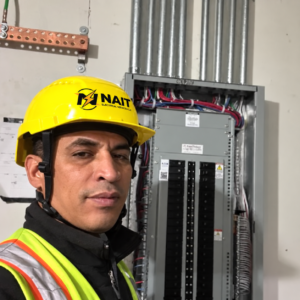 Nait electrician working on an electrical panel